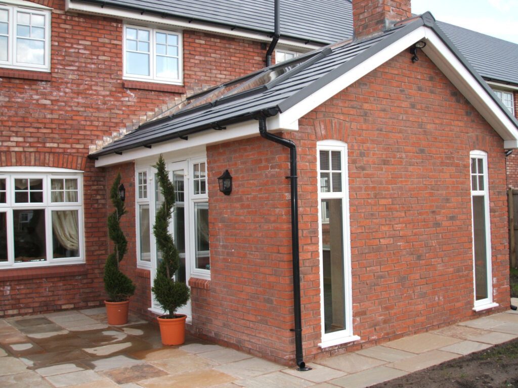 Modern brick home with white casement windows