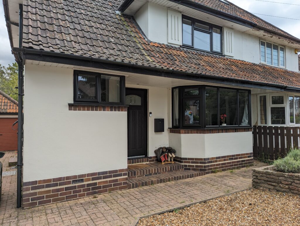 white home with modern black window frames